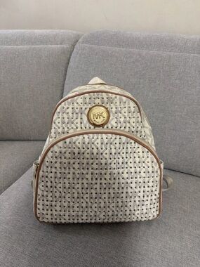 Michael Kors Cream Logo Backpack with Brown Trim and Gold MK Medallion